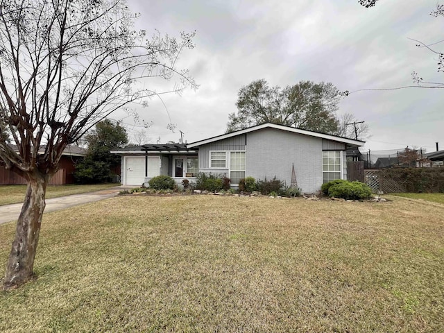 single story home featuring a front yard and a garage