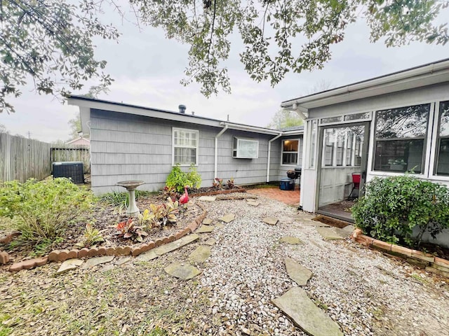 rear view of property featuring central air condition unit