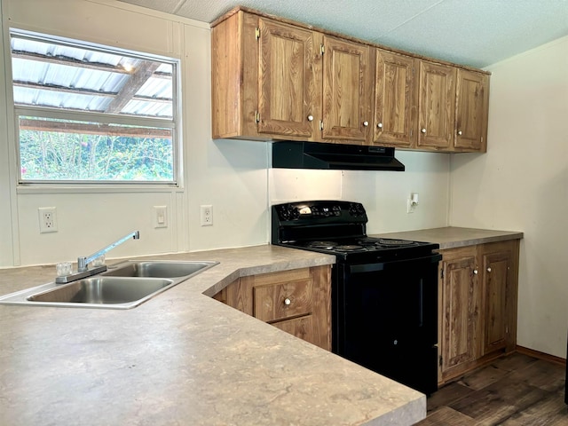 kitchen with sink, dark hardwood / wood-style floors, black range with electric cooktop, and a textured ceiling