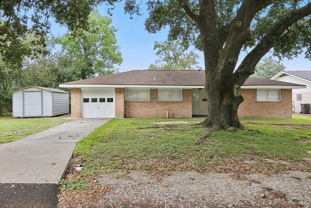 ranch-style house with a shed, a front yard, and a garage