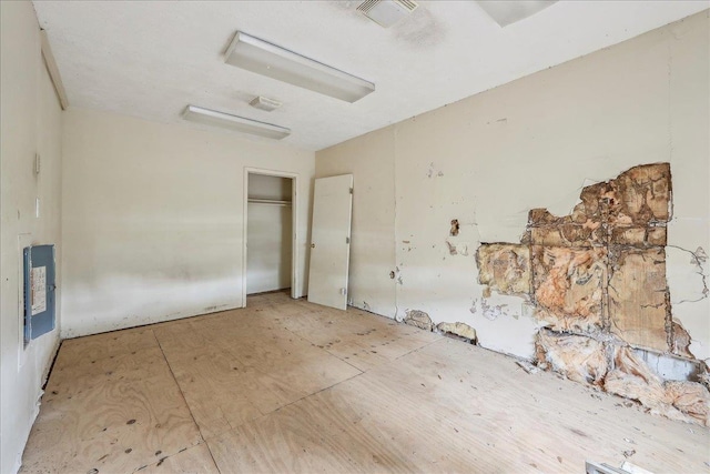 unfurnished bedroom featuring visible vents