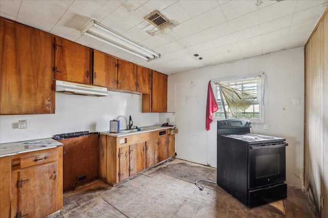 kitchen featuring under cabinet range hood, brown cabinets, visible vents, and black electric range