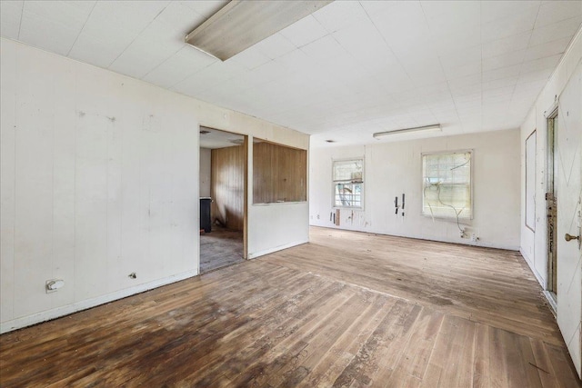 unfurnished living room featuring wood-type flooring
