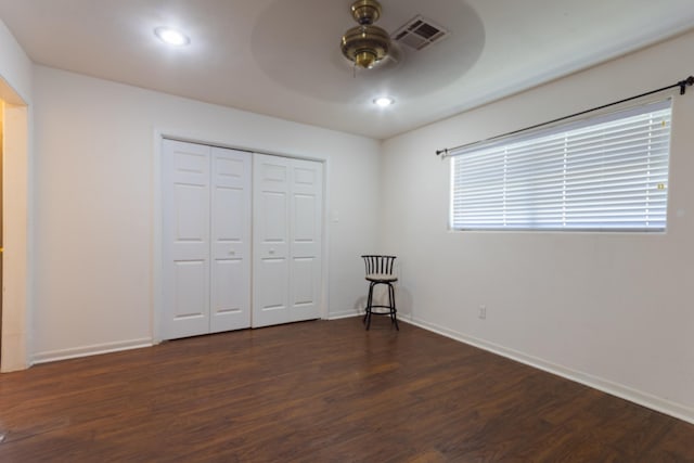 6470 Wilder Dr, Beaumont, TX 77706 - unfurnished bedroom with dark wood-style flooring, baseboards, a closet, a ceiling fan, and recessed lighting