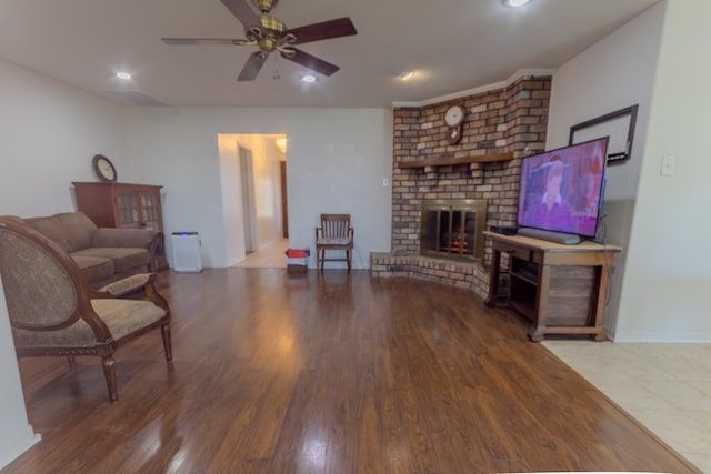 6470 Wilder Dr, Beaumont, TX 77706 - living room with a ceiling fan, wood finished floors, a brick fireplace, baseboards, and recessed lighting