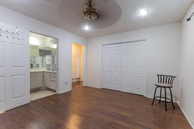 6470 Wilder Dr, Beaumont, TX 77706 - unfurnished bedroom featuring wood finished floors, baseboards, a closet, ensuite bathroom, and a ceiling fan