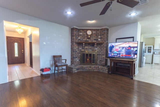6470 Wilder Dr, Beaumont, TX 77706 - living area featuring a ceiling fan, a brick fireplace, wood finished floors, and recessed lighting