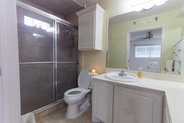 6470 Wilder Dr, Beaumont, TX 77706 - full bath featuring vanity, a stall shower, toilet, and tile patterned flooring