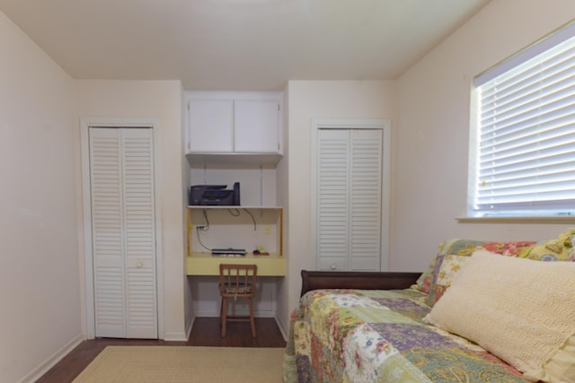 6470 Wilder Dr, Beaumont, TX 77706 - bedroom with two closets, wood finished floors, and baseboards