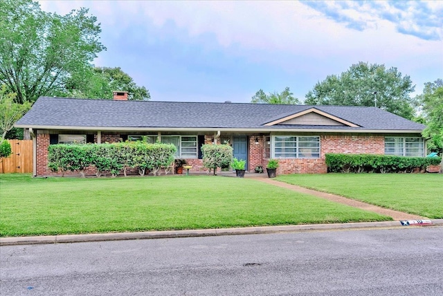 10 Knotty Pine Ln, Orange, TX 77630 - ranch-style house featuring brick siding, a chimney, and roof with shingles