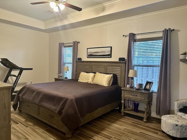 bedroom with ceiling fan and ornamental molding