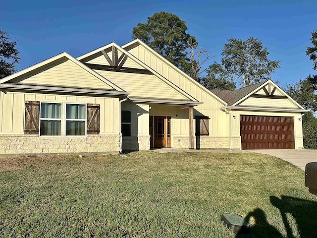 view of front of property with a garage and a front yard