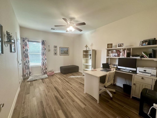 office with ceiling fan and light hardwood / wood-style flooring