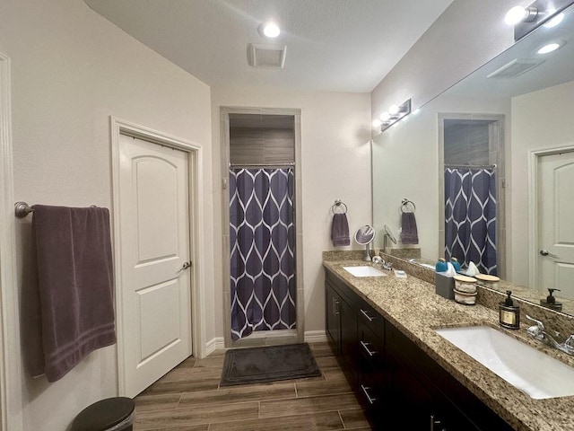 bathroom featuring vanity and walk in shower