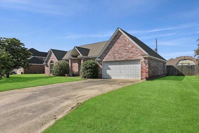 view of front facade with a garage and a front yard