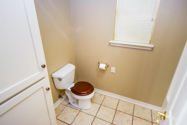 bathroom featuring tile patterned flooring and toilet