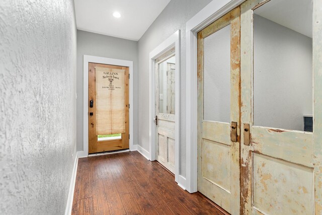 2050 Aggie Dr, Beaumont, TX 77713 - entryway featuring baseboards and dark wood-style flooring