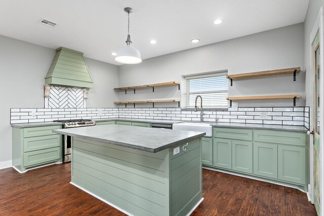 2050 Aggie Dr, Beaumont, TX 77713 - kitchen with green cabinetry, a sink, stainless steel range with gas cooktop, and open shelves
