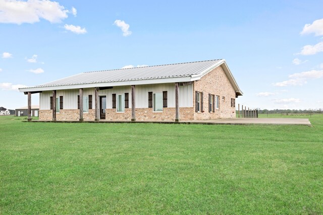 2050 Aggie Dr, Beaumont, TX 77713 - exterior space with brick siding, metal roof, and a front yard