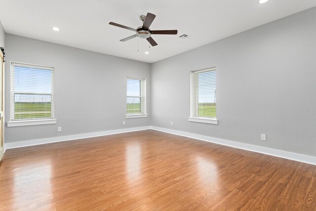 2050 Aggie Dr, Beaumont, TX 77713 - unfurnished room featuring recessed lighting, baseboards, visible vents, a ceiling fan, and wood finished floors