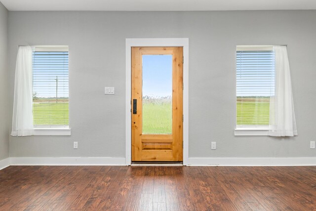 2050 Aggie Dr, Beaumont, TX 77713 - foyer entrance with baseboards and dark wood-style flooring