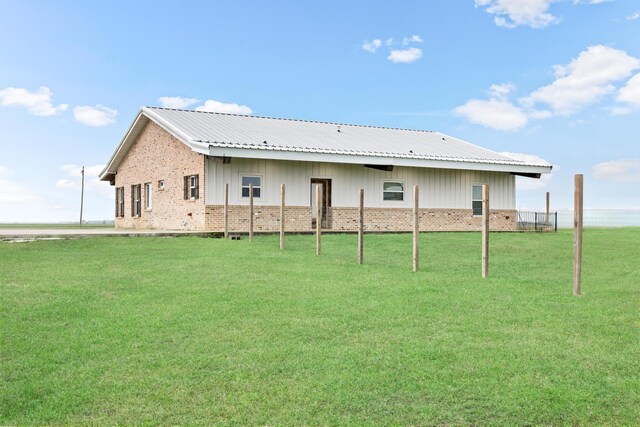 2050 Aggie Dr, Beaumont, TX 77713 - rear view of house featuring a lawn
