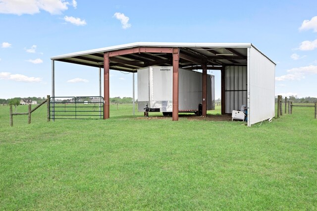 2050 Aggie Dr, Beaumont, TX 77713 - view of pole building featuring driveway and a lawn