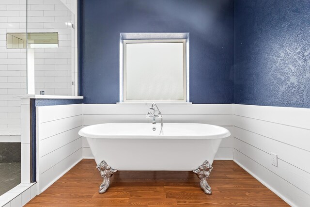 2050 Aggie Dr, Beaumont, TX 77713 - full bathroom with a soaking tub, wood finished floors, and tiled shower
