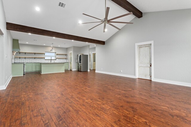 2050 Aggie Dr, Beaumont, TX 77713 - unfurnished living room with dark wood-style flooring, baseboards, beam ceiling, visible vents, and a ceiling fan