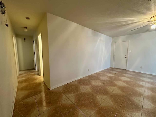 4220 Flamingo Ln, Beaumont, TX 77705 - tiled spare room featuring ceiling fan and baseboards