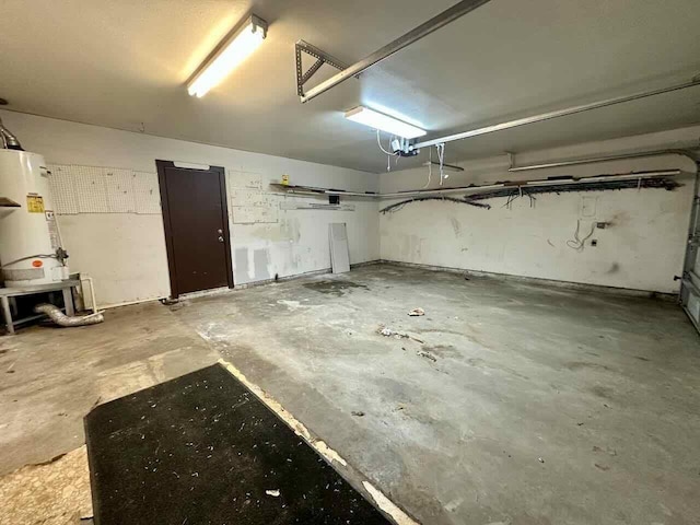 4220 Flamingo Ln, Beaumont, TX 77705 - garage with gas water heater and a garage door opener