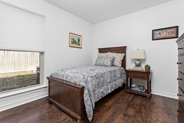 bedroom featuring dark hardwood / wood-style flooring