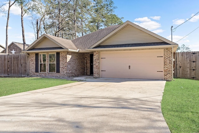 view of front of house with a front yard and a garage