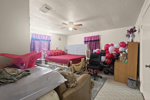 2850 S Major Dr, Beaumont, TX 77707 - carpeted bedroom featuring a textured ceiling and a ceiling fan