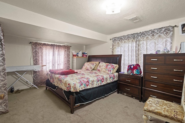 2850 S Major Dr, Beaumont, TX 77707 - bedroom featuring light colored carpet and a textured ceiling
