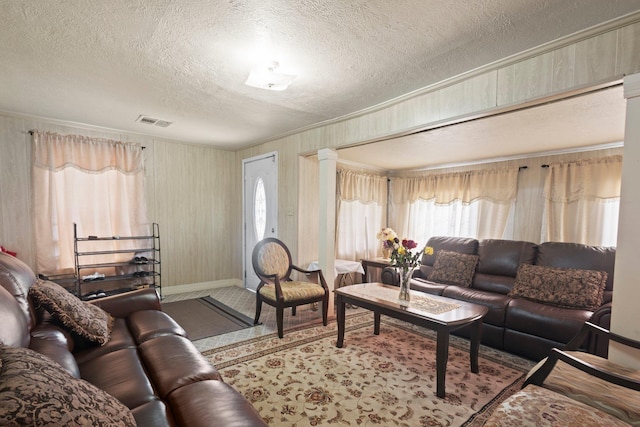 2850 S Major Dr, Beaumont, TX 77707 - living room featuring a textured ceiling and healthy amount of natural light