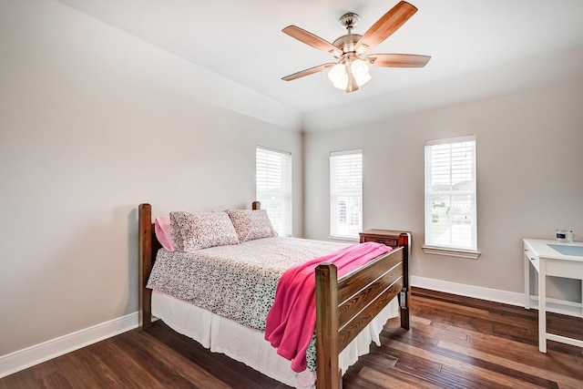 bedroom featuring ceiling fan and dark wood-type flooring