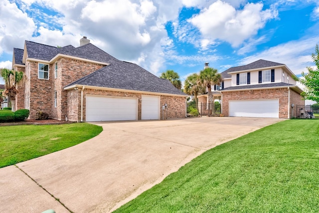 view of front property featuring a front yard and a garage