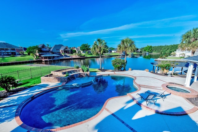 view of pool with a water view, an in ground hot tub, and a patio