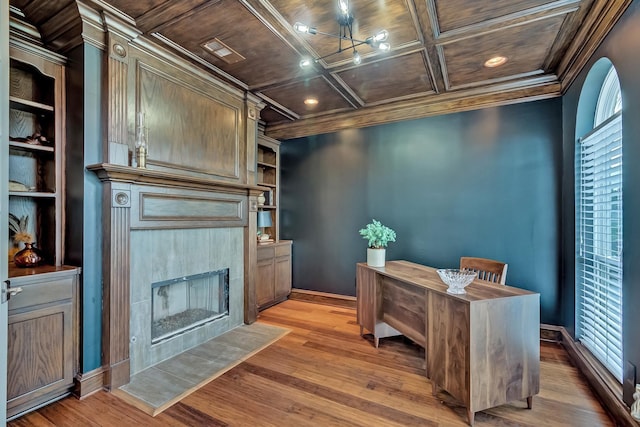 home office with built in features, coffered ceiling, and wood ceiling