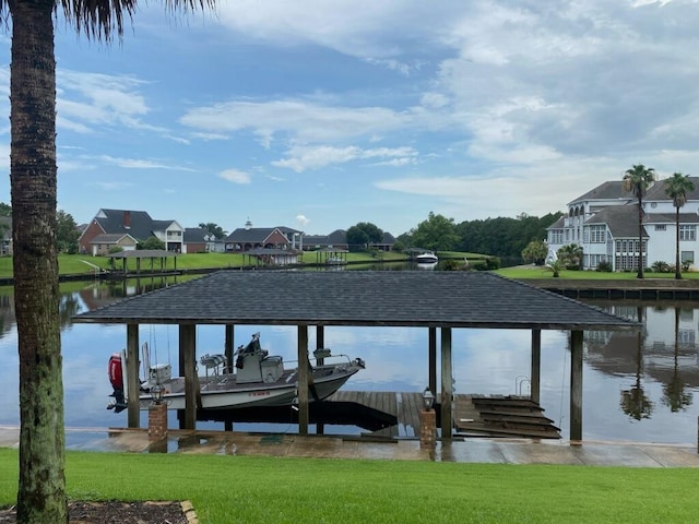 dock area featuring a yard and a water view