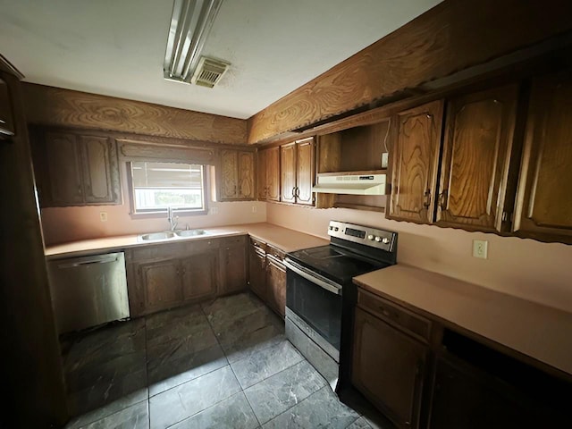 849 Dillon Dr, Silsbee, TX 77656 - kitchen with appliances with stainless steel finishes, under cabinet range hood, and light countertops
