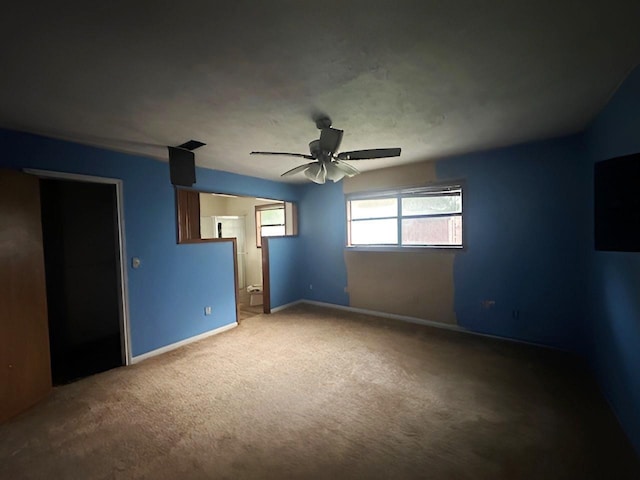 849 Dillon Dr, Silsbee, TX 77656 - unfurnished bedroom with carpet floors, a ceiling fan, and ensuite bath