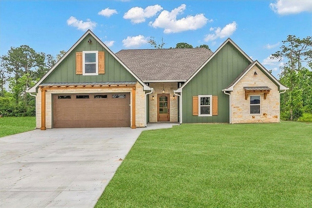 view of front of house featuring a front yard and a garage