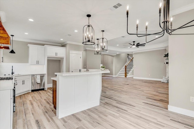 kitchen with dishwasher, pendant lighting, a center island with sink, white cabinets, and ceiling fan with notable chandelier