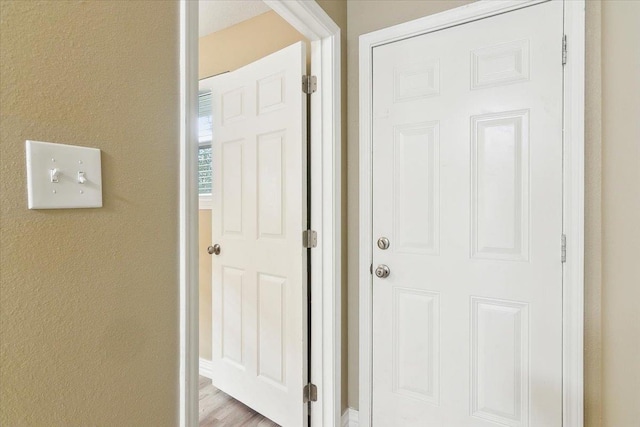 doorway to outside with light hardwood / wood-style floors