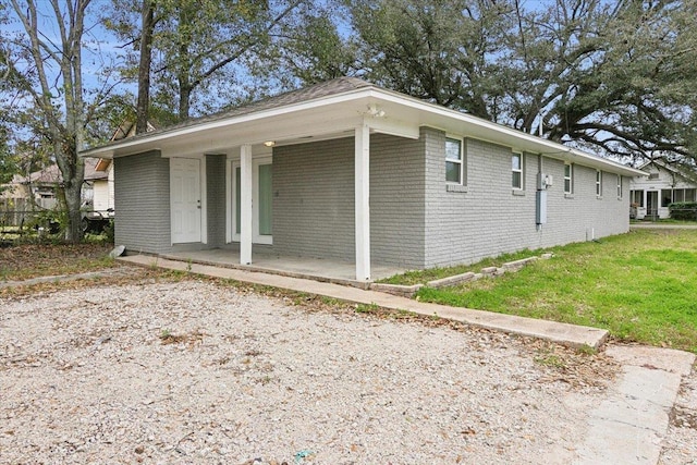 view of property exterior with covered porch