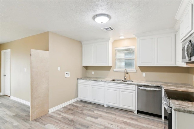 kitchen with light stone countertops, stainless steel appliances, sink, light hardwood / wood-style flooring, and white cabinets