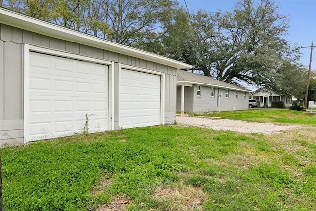 garage featuring a yard