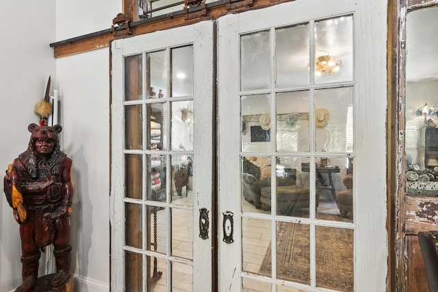 details featuring a barn door and french doors